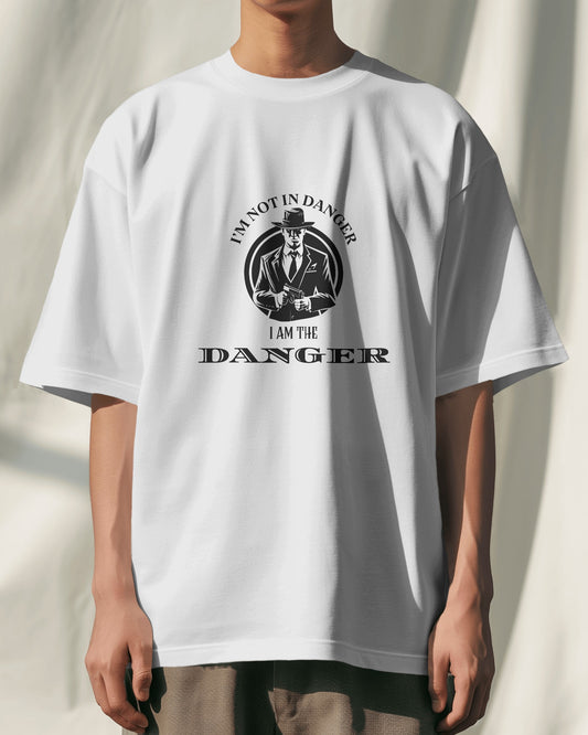 White oversized t-shirt with graphic design and text worn by a person on a plain background 100% Cotton – Premium Quality
Free Shipping
Standard Length | Oversized Fit | Round Neck | Half Sleeves
I am not in danger, I am the danger