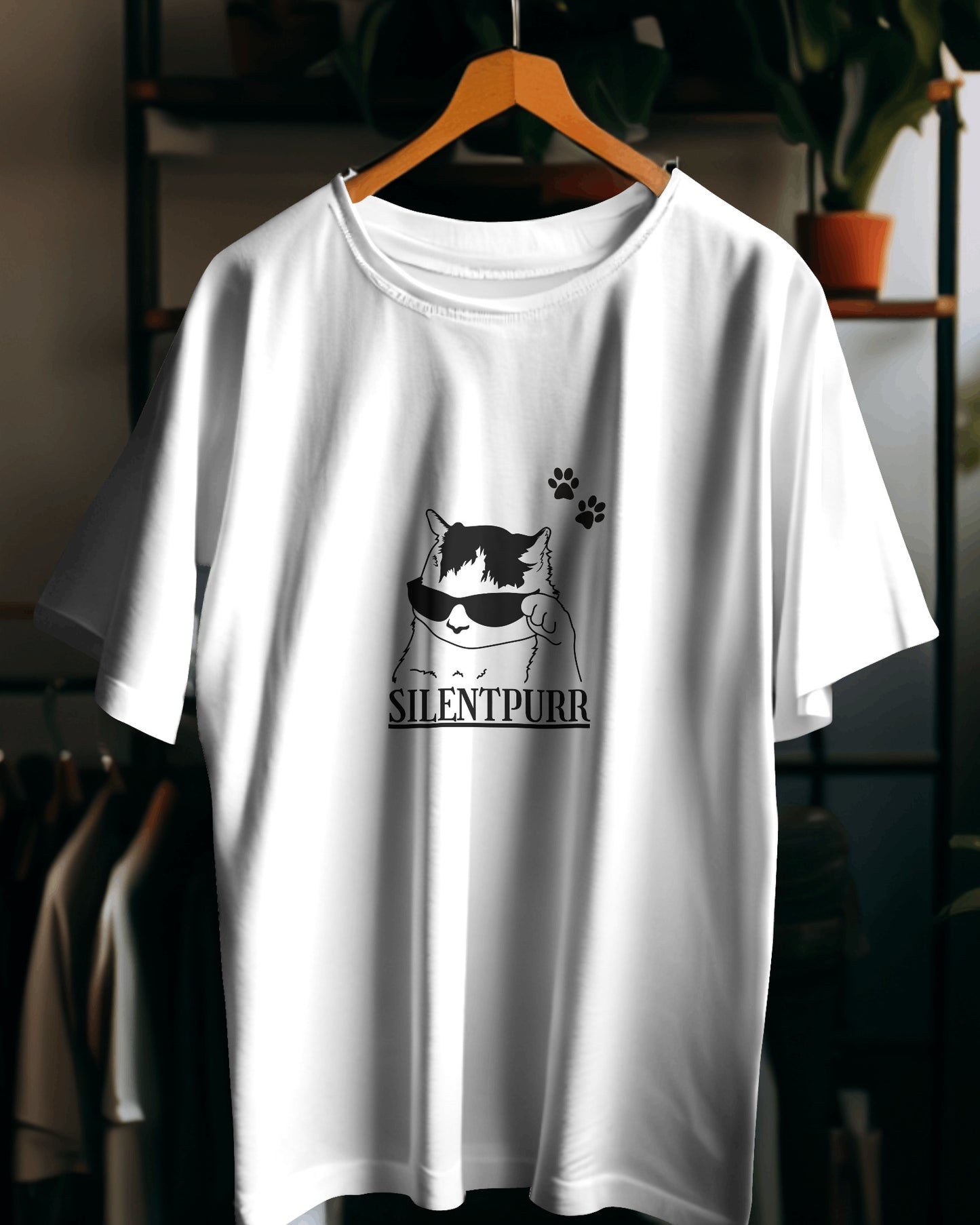 White t-shirt with a cat graphic and 'SILENTPUUR' text on a hanger.