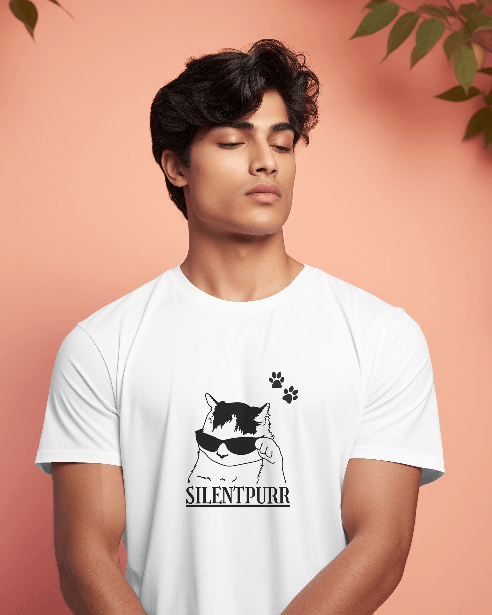 Person wearing a white t-shirt with a cat graphic and 'SILENTPURR' text on a peach background