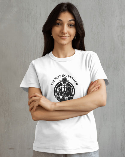 Woman wearing a white t-shirt with a graphic design and text against a gray background